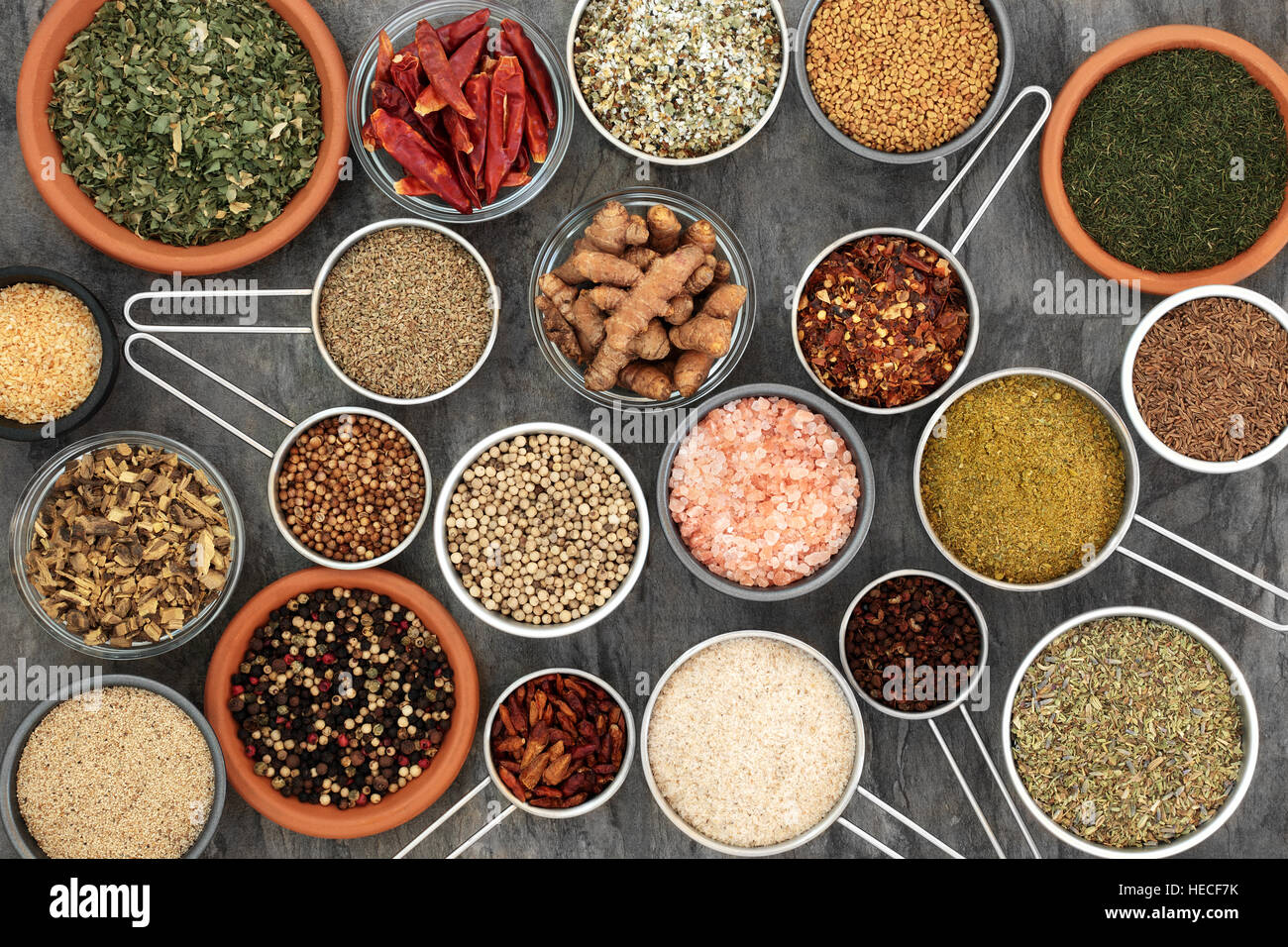 Herb and spice seasoning for cooking in scoops and bowls forming a