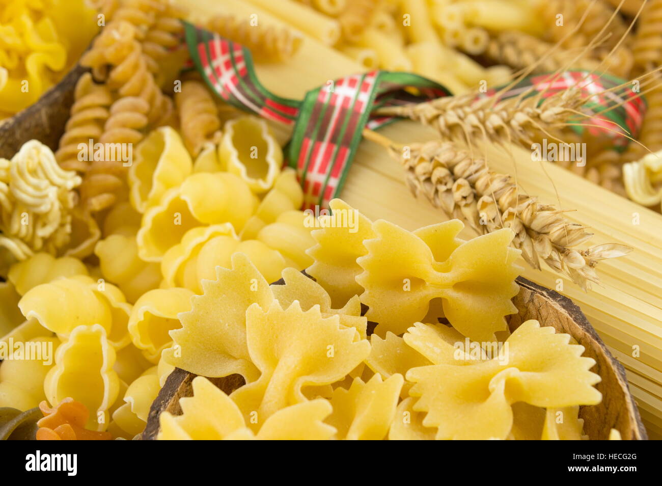 different types of uncooked pasta on a pile Stock Photo