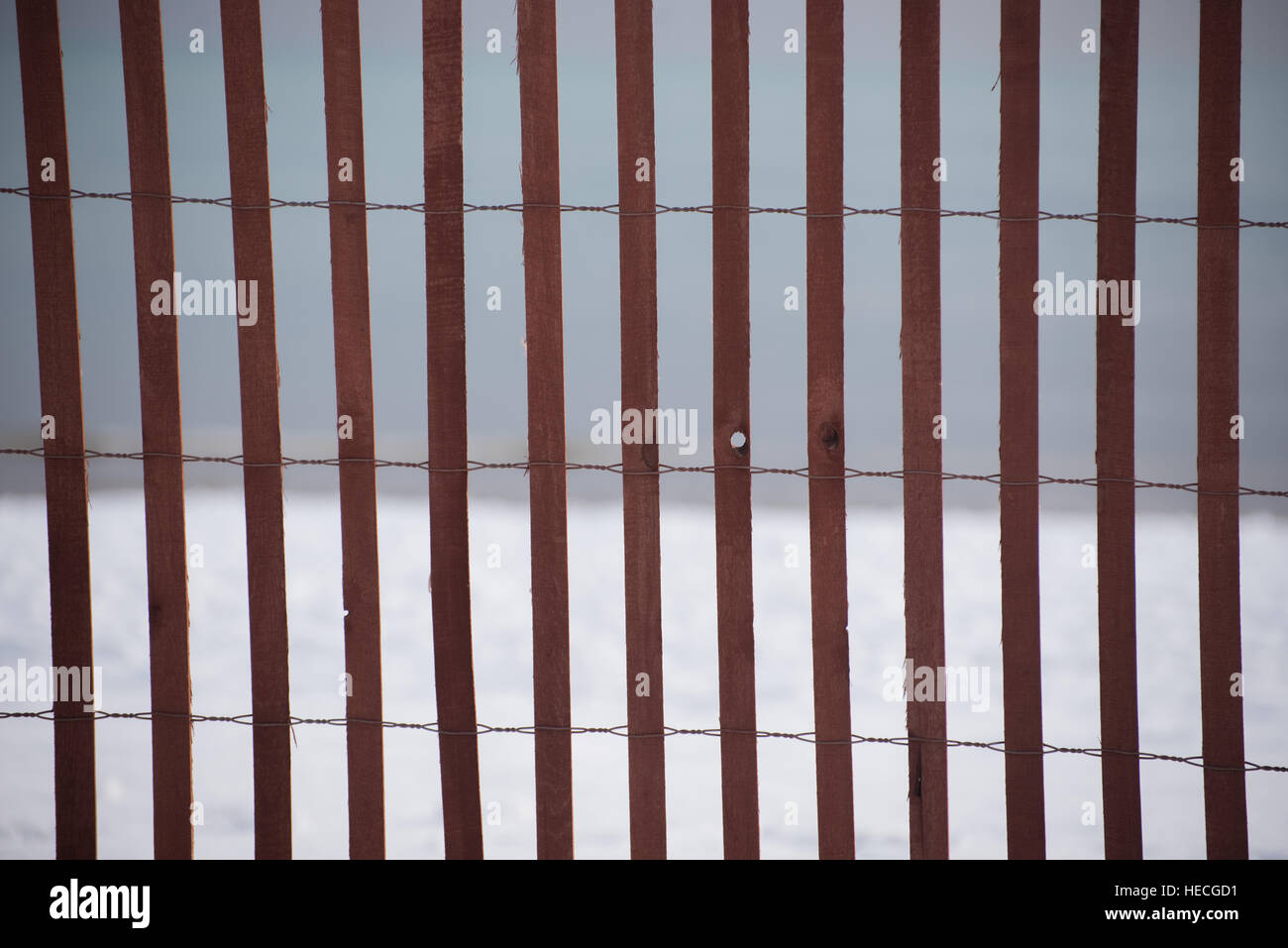 Fence on a lake Stock Photo - Alamy