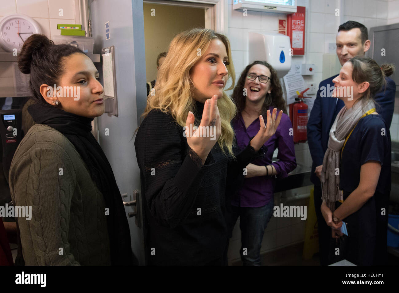 Singer Ellie Goulding (centre) meets users of the Marylebone Centre in London, which provides accommodation, training and skills support for homeless women. Stock Photo