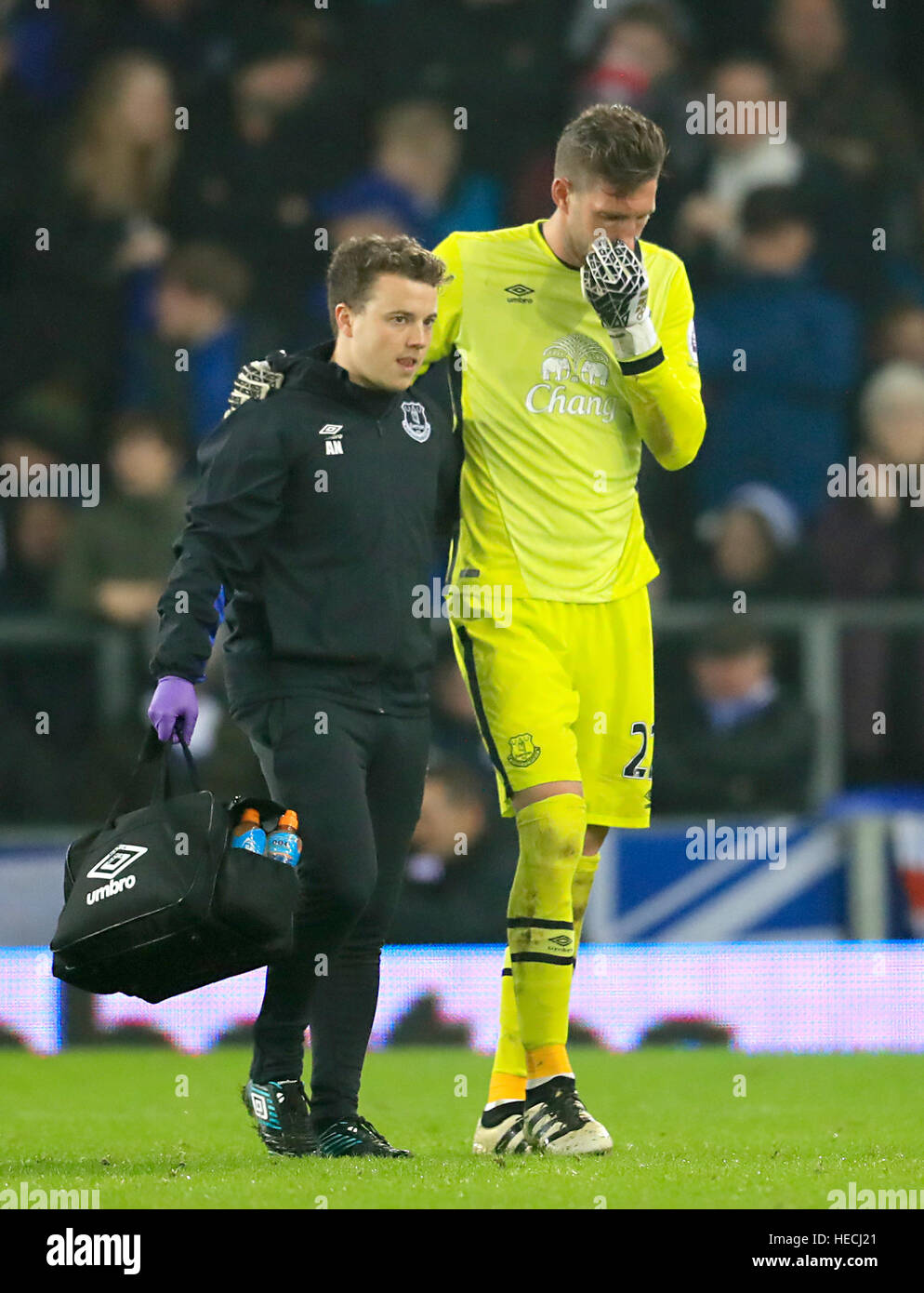 Everton Goalkeeper Maarten Stekelenburg Is Led Off The Pitcb By Medical Staff During The Premier League Match At Goodison Park Liverpool Stock Photo Alamy