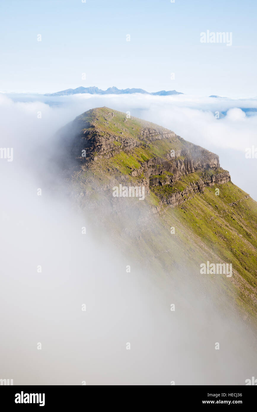 Hallival mountain emerging from mist, looking towards the Isle of Skye, Isle of rum, Inner Hebrides, Scotland, UK Stock Photo