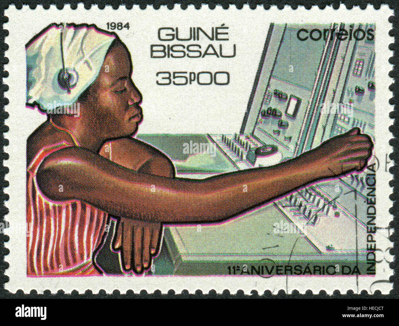 A stamp printed in Guinea-Bissau, dedicated to 11th Anniversary of Independence, shows the Telecommunications Stock Photo