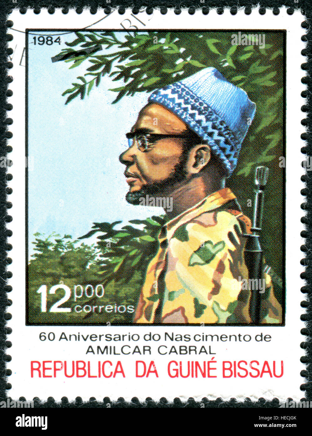 A stamp printed in Guinea-Bissau, devoted to 60th Anniv. of Birth Amilcar Cabral, shows the Amilcar Cabral in combat fatigues Stock Photo