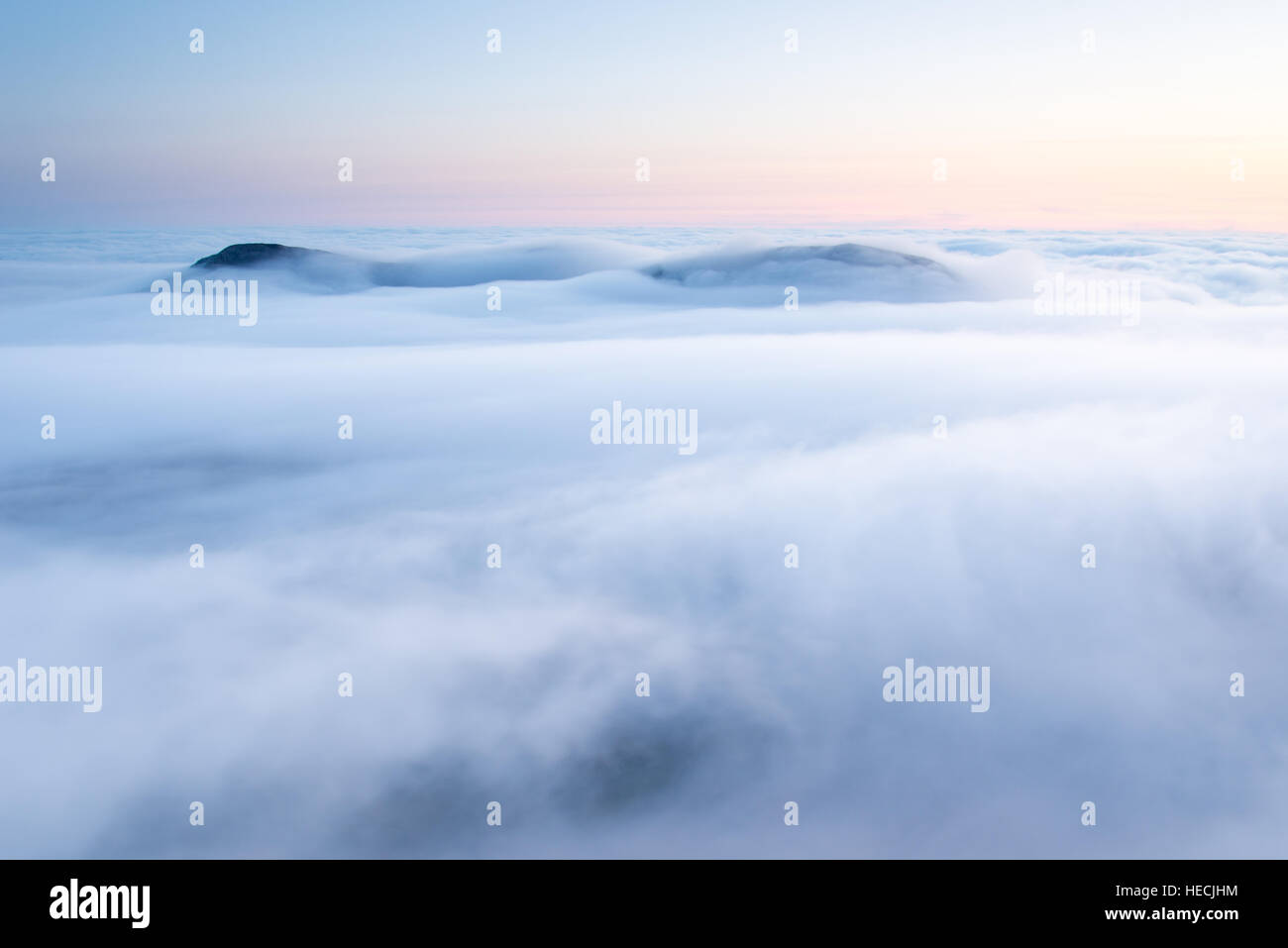 Mountaintops poking through sea mist and clouds, Isle of Rum, Inner Herbides, Scotland Stock Photo