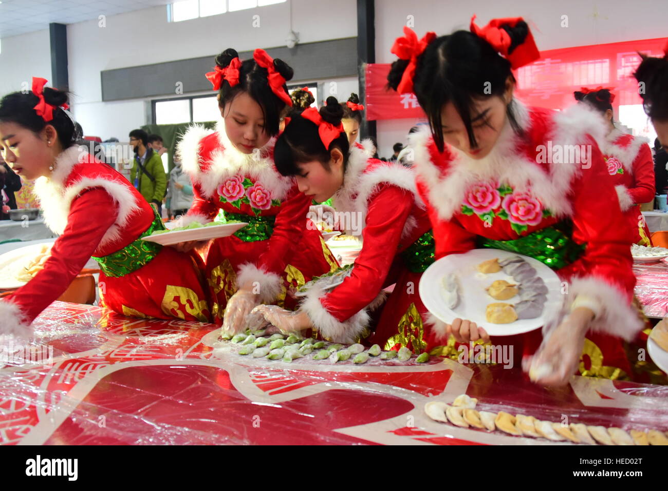 Zhengzhou, Zhengzhou, China. 20th Dec, 2016. Zhengzhou, CHINA-December 20 2016: (EDITORIAL USE ONLY. CHINA OUT) .Students make thousands of dumplings for street cleaners at Henan University of Agriculture in Zhengzhou, capital of central China's Henan Province, December 20th, 2016, marking the solar term 'Winter Solstice'. The dumplings were laid in a pattern of the Chinese character 'Fu' which means good luck. The traditional Chinese lunar calendar divides the year into 24 solar terms. Winter Solstice, the 22nd solar term of the year, begins this year on Dec 21 and ends on Jan 4. On the Stock Photo