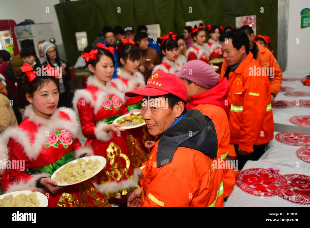Zhengzhou, Zhengzhou, China. 20th Dec, 2016. Zhengzhou, CHINA-December 20 2016: (EDITORIAL USE ONLY. CHINA OUT) .Students make thousands of dumplings for street cleaners at Henan University of Agriculture in Zhengzhou, capital of central China's Henan Province, December 20th, 2016, marking the solar term 'Winter Solstice'. The dumplings were laid in a pattern of the Chinese character 'Fu' which means good luck. The traditional Chinese lunar calendar divides the year into 24 solar terms. Winter Solstice, the 22nd solar term of the year, begins this year on Dec 21 and ends on Jan 4. On the Stock Photo