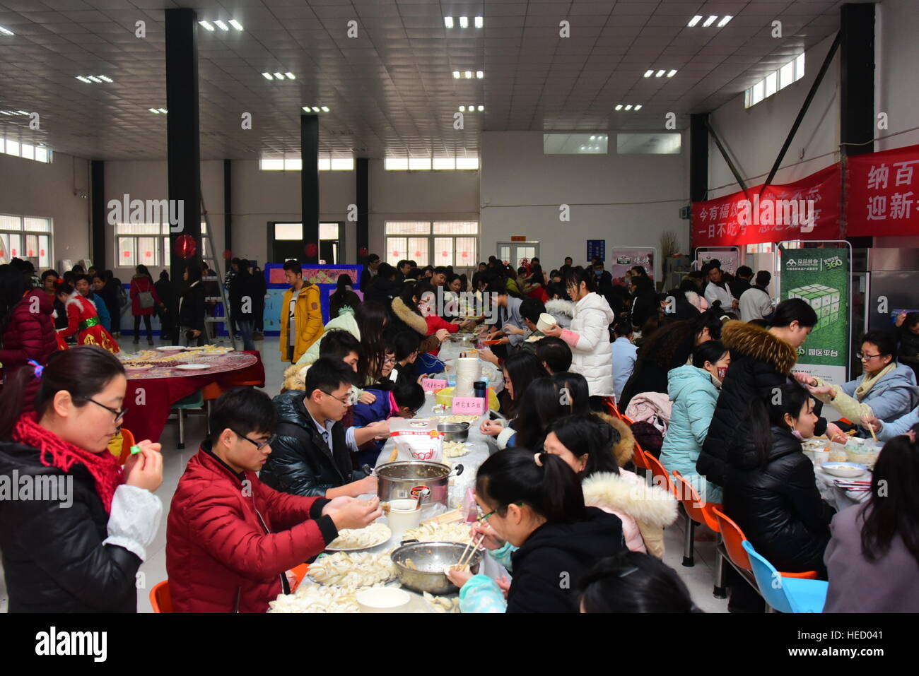 Zhengzhou, Zhengzhou, China. 20th Dec, 2016. Zhengzhou, CHINA-December 20 2016: (EDITORIAL USE ONLY. CHINA OUT) .Students make thousands of dumplings for street cleaners at Henan University of Agriculture in Zhengzhou, capital of central China's Henan Province, December 20th, 2016, marking the solar term 'Winter Solstice'. The dumplings were laid in a pattern of the Chinese character 'Fu' which means good luck. The traditional Chinese lunar calendar divides the year into 24 solar terms. Winter Solstice, the 22nd solar term of the year, begins this year on Dec 21 and ends on Jan 4. On the Stock Photo