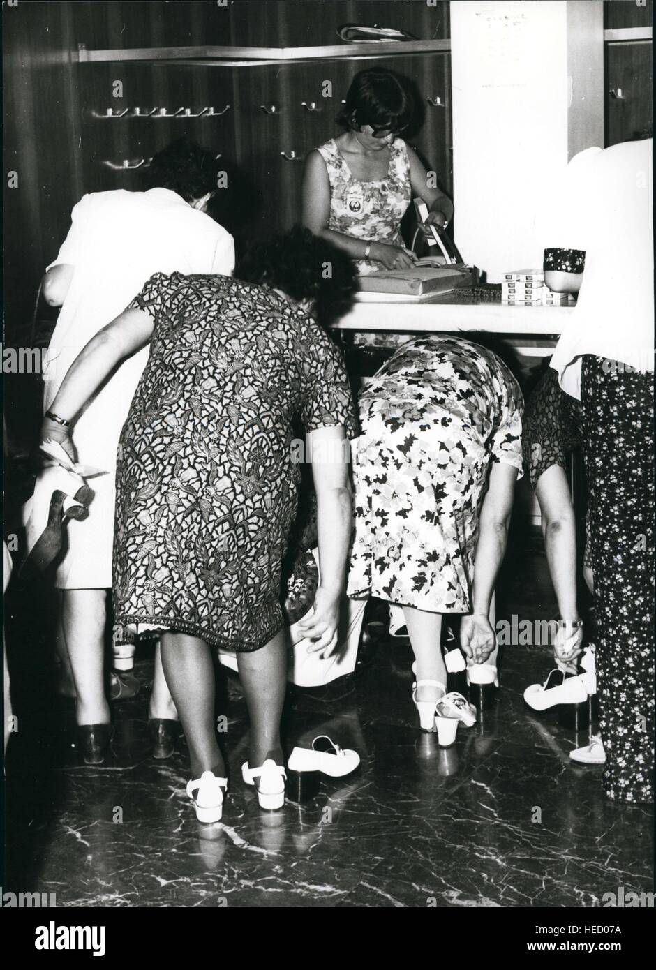 Apr. 17, 1955 - women try on shoes straps bent over floral dress security  prayer clean floor © Keystone Pictures USA/ZUMAPRESS.com/Alamy Live News  Stock Photo - Alamy