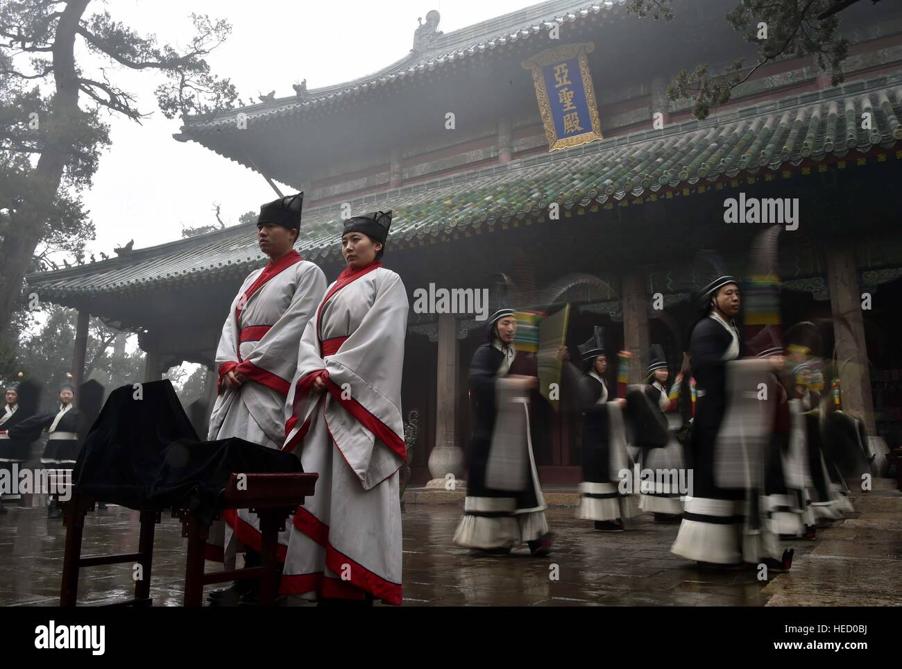 Zoucheng. 21st Dec, 2016. A traditional sacrificial ceremony is held to commemorate Mencius at the Temple and Family Mansion of Mencius in Zoucheng City, east China's Shandong Province, Dec. 21, 2016, the Winter Solstice. Mencius (372-289 BC), or Meng Zi, was a great philosopher of ancient China. He traveled all his life expounding Confucianism. © Zhu Zheng/Xinhua/Alamy Live News Stock Photo