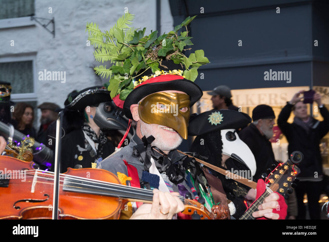 Penzance, Cornwall, UK. 21st December 2016. The annual Montol festival held on the date of the feast of St Thomas the Apostle and the winter solstice. Guise processions and lantern parades take place leading to the chalking of the Mock. The first parade seen here at sundown. Credit: Simon Maycock/Alamy Live News Stock Photo