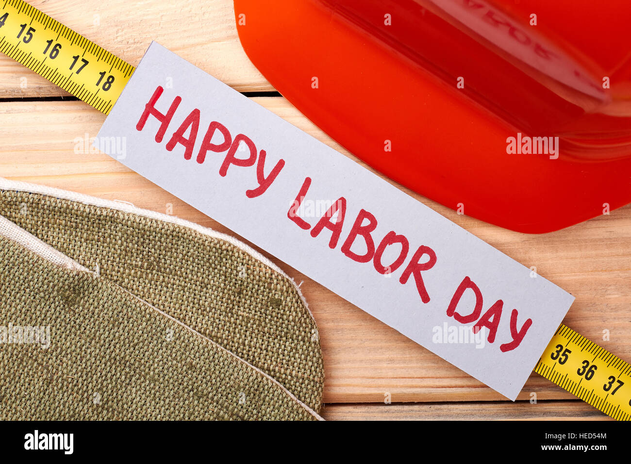 Hard hat and tape measure Stock Photo - Alamy