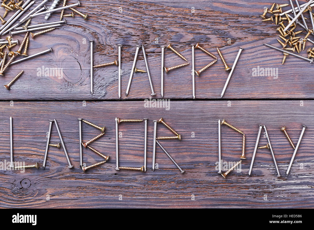 Labor Day words by screws Stock Photo - Alamy