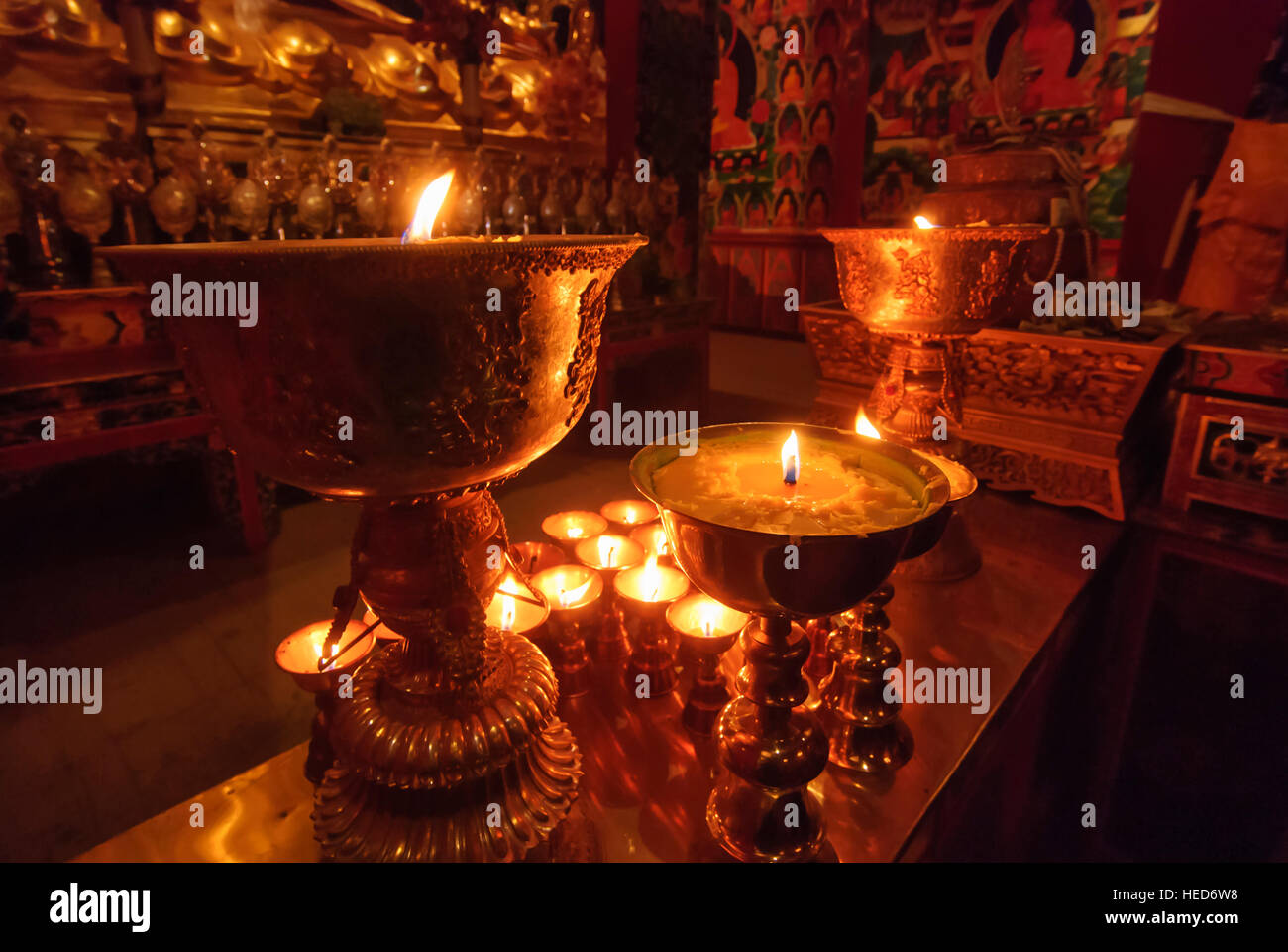 Xiahe: Tibetan monastery Labrang; Hall of the Horseheaded Buddha; Candles of yak butter, Tibet, Gansu, China Stock Photo