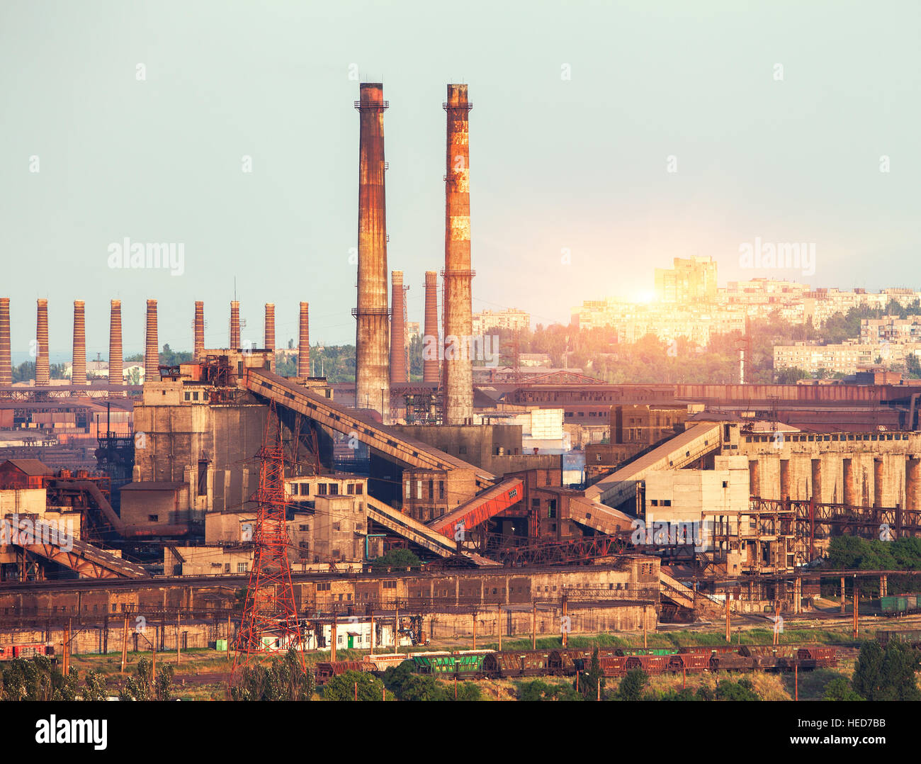 Metallurgical plant at colorful sunset. Industrial landscape. Steel factory in the city. Steel works, iron works. Heavy industry Stock Photo