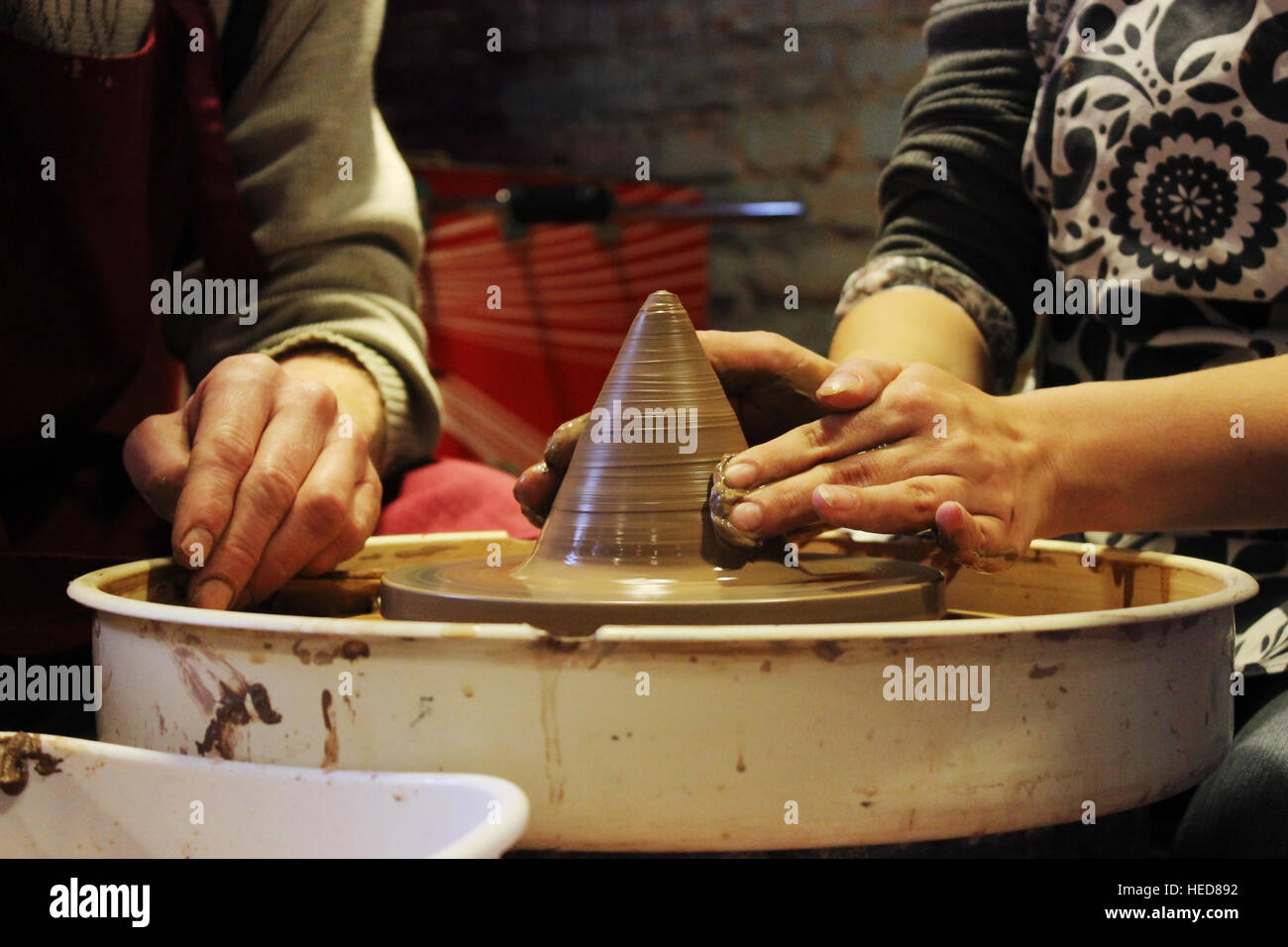 experienced master potter teaches the art of making pots clay on the 's wheel Stock Photo Alamy