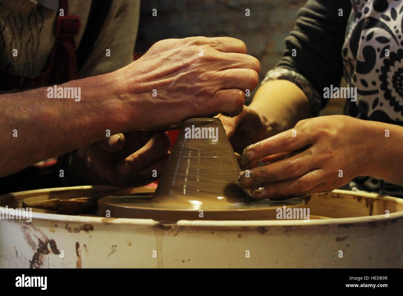 experienced master potter teaches the art of making pots clay on the 's wheel Stock Photo Alamy