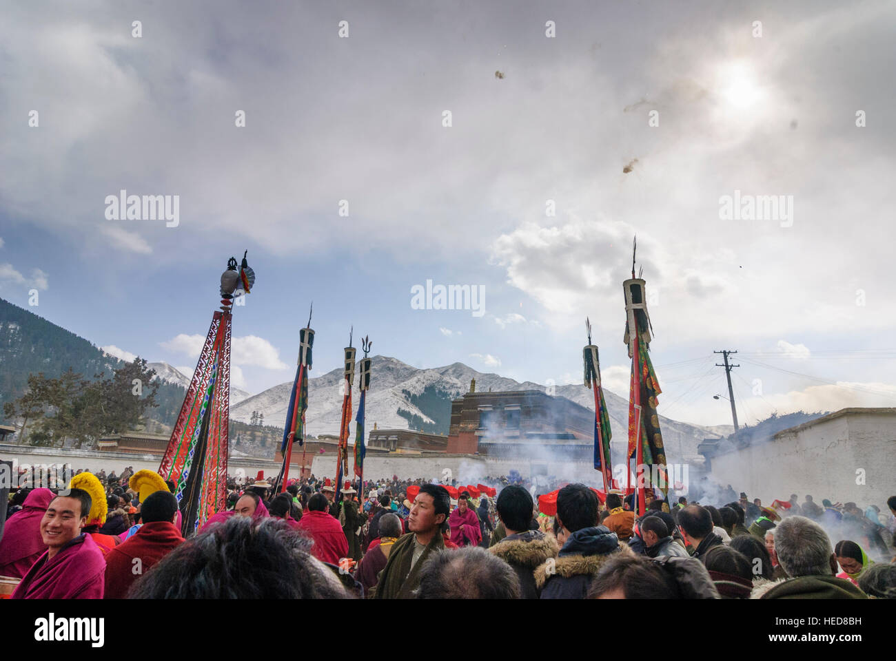 Xiahe: Tibetan Monastery Labrang at the Monlam Festival; Cham dance (masquerade); Shooting of firecrackers, Tibet, Gansu, China Stock Photo