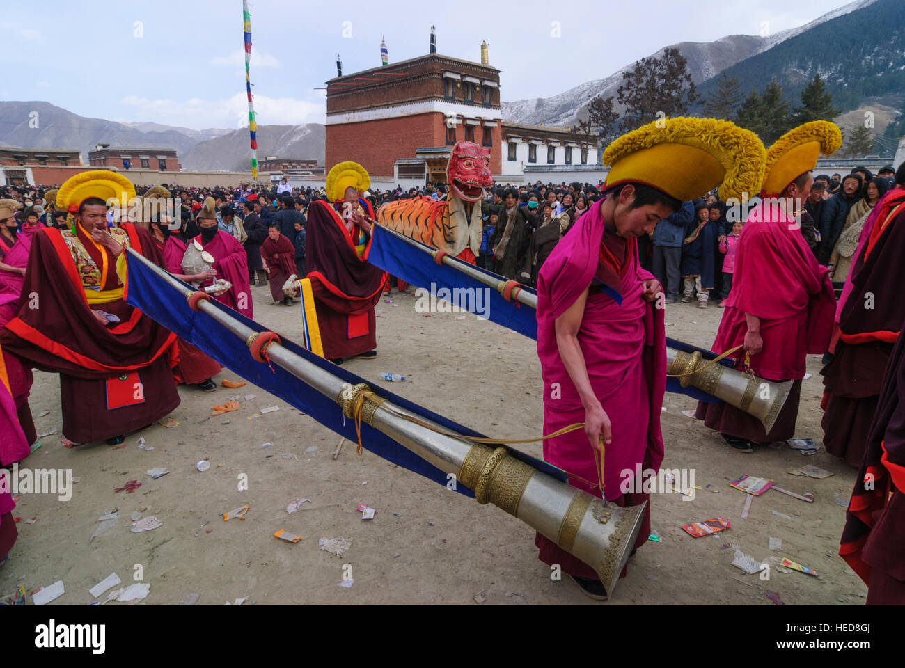 Xiahe: Tibetan Monastery Labrang at the Monlam Festival; Cham dance (masquerade); Guardians secure the exile of the monks with Dungchen (horn), Tibet, Stock Photo