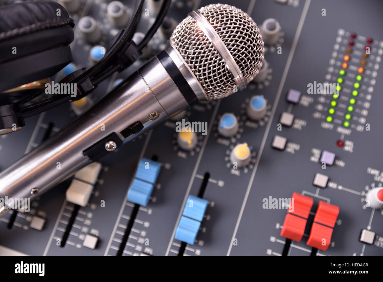 Recording equipment in studio. Studio microphone with headphones and mixer  background. Top view Stock Photo - Alamy