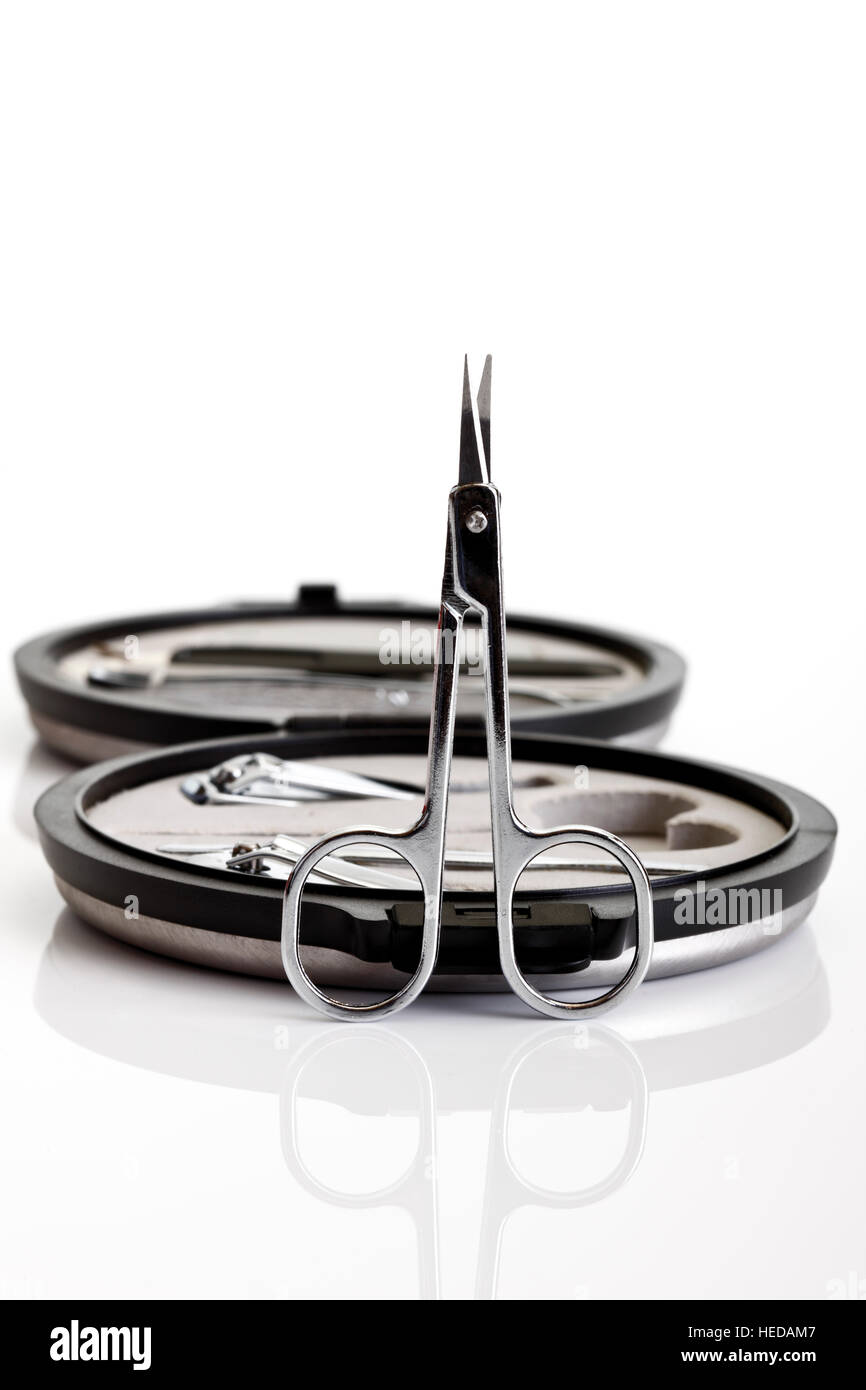 Nail scissors in front of a manicure set Stock Photo Alamy
