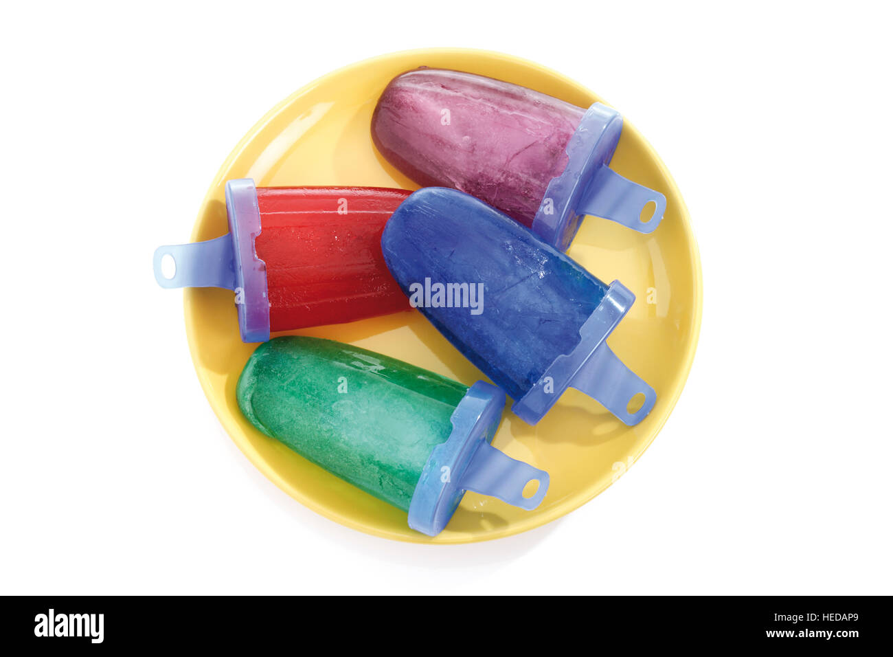 Homemade popsicles, ice lollies or ice pops, moulds, various colours Stock Photo