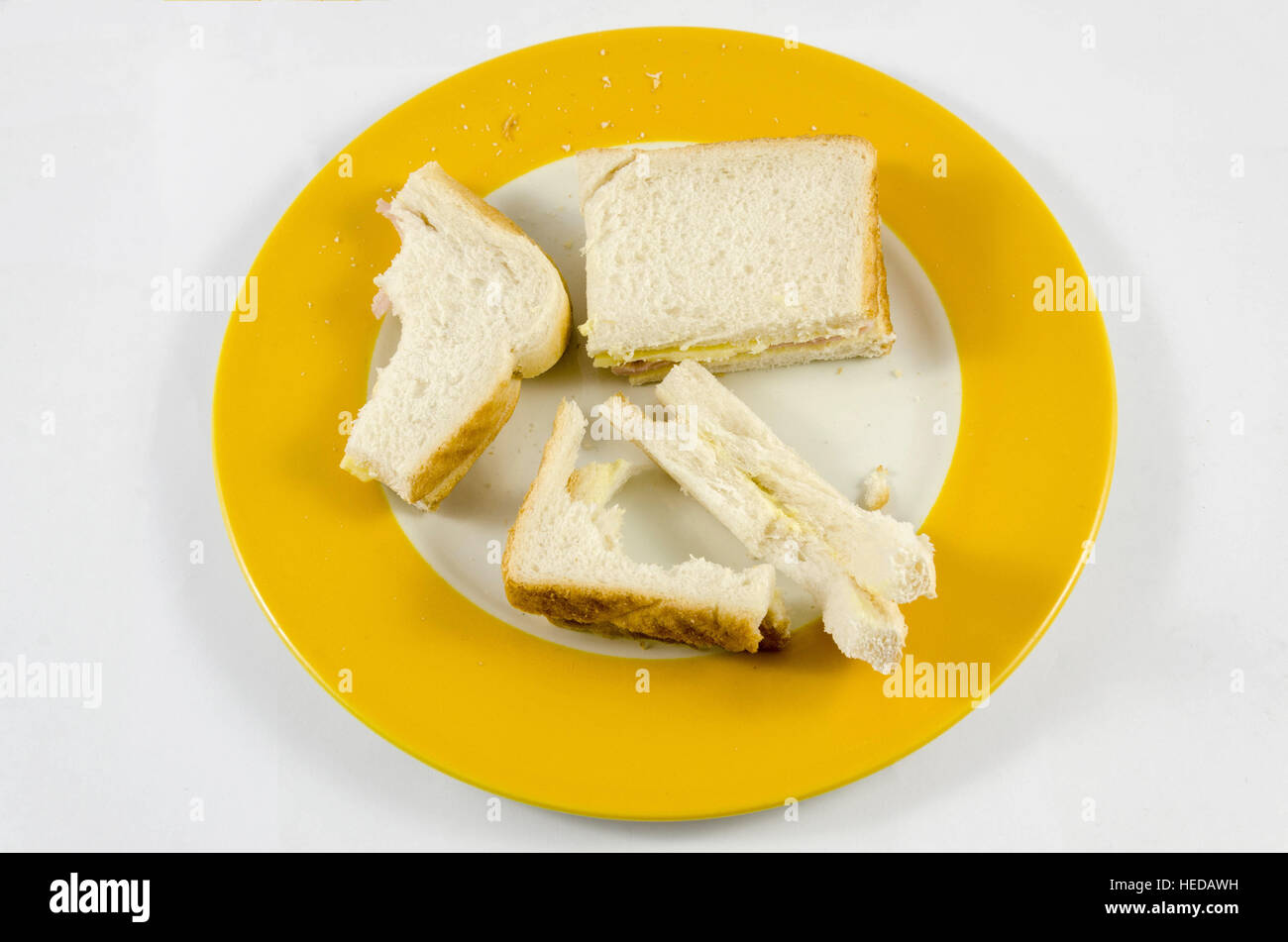 Half-eaten sandwiches on a plated. Stock Photo