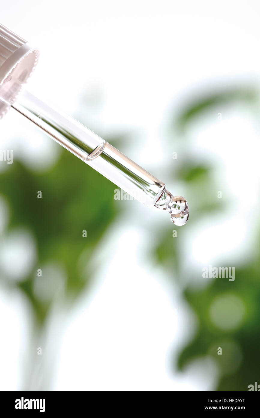 Eye dropper or pipette full of homeopathic medicine Stock Photo Alamy