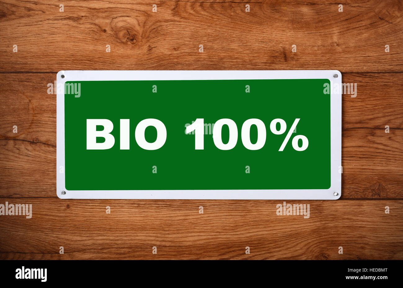 plaque with the inscription bio 100 % on the wooden wall Stock Photo