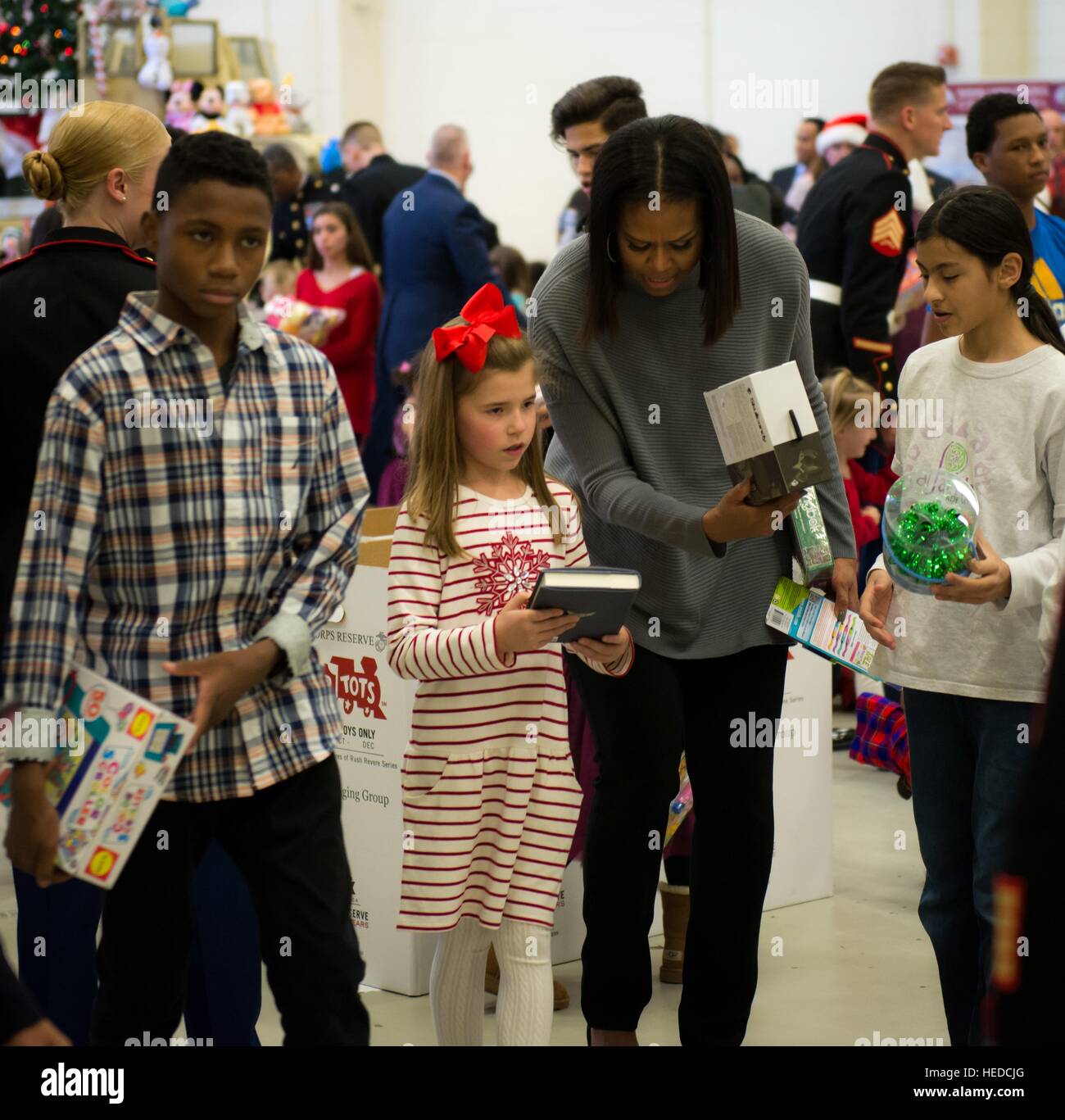 U.S. First Lady Michelle Obama helps hand out toy and presents during a Toys for Tots toy sorting event at the Joint Base Anacostia-Bolling December 7, 2016 in Washington, DC. Stock Photo