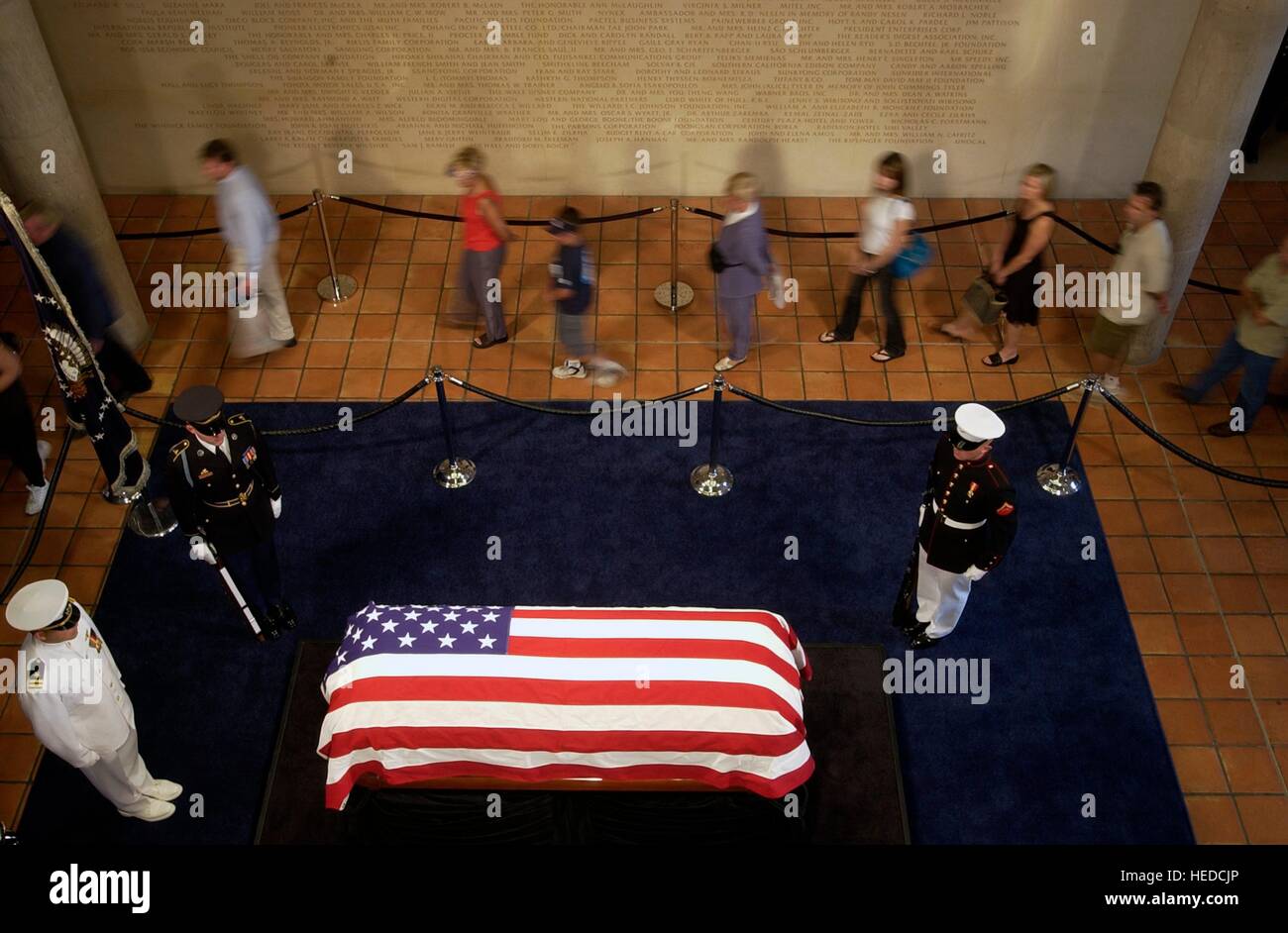 Mourners file in and take turns paying their respects to the casket of former U.S. President Ronald Reagan during a state funeral at the Ronald Reagan Presidential Library rotunda June 7, 2004 in Simi Valley, California. Stock Photo