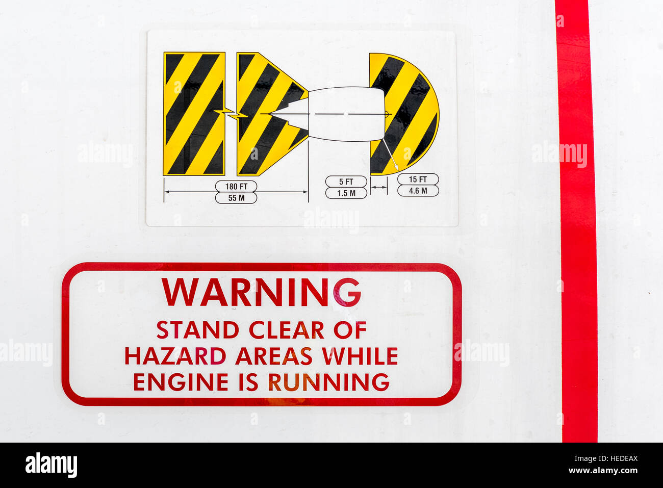 Warning sign on an aircraft engine about the hazardous areas around a
