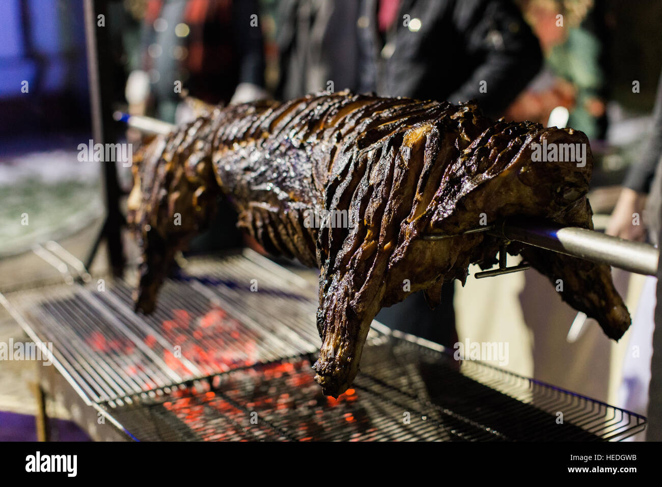 Roasting pig barbeque outside. Party Stock Photo