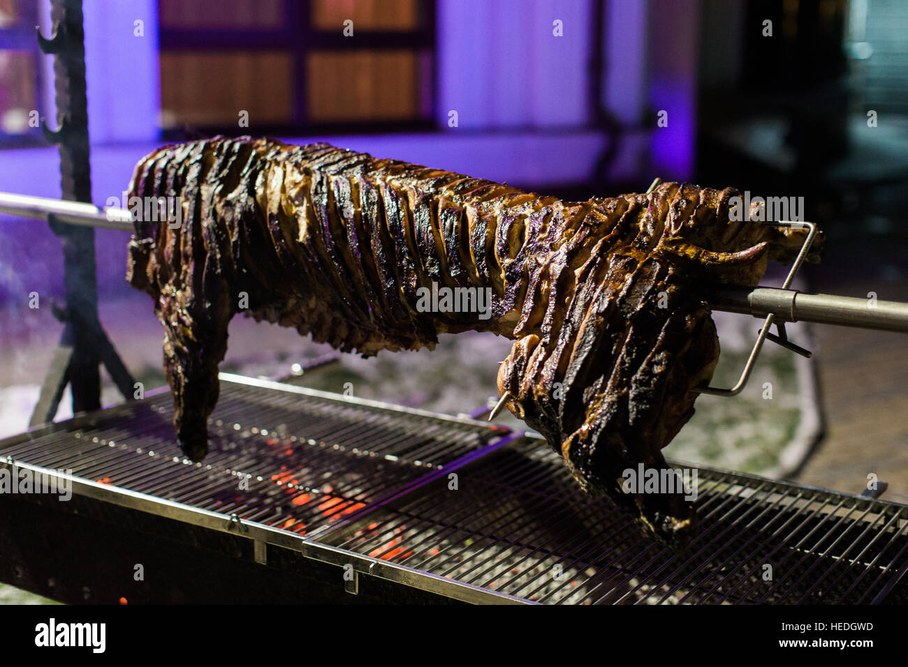 Roasting pig barbeque outside. Party Stock Photo