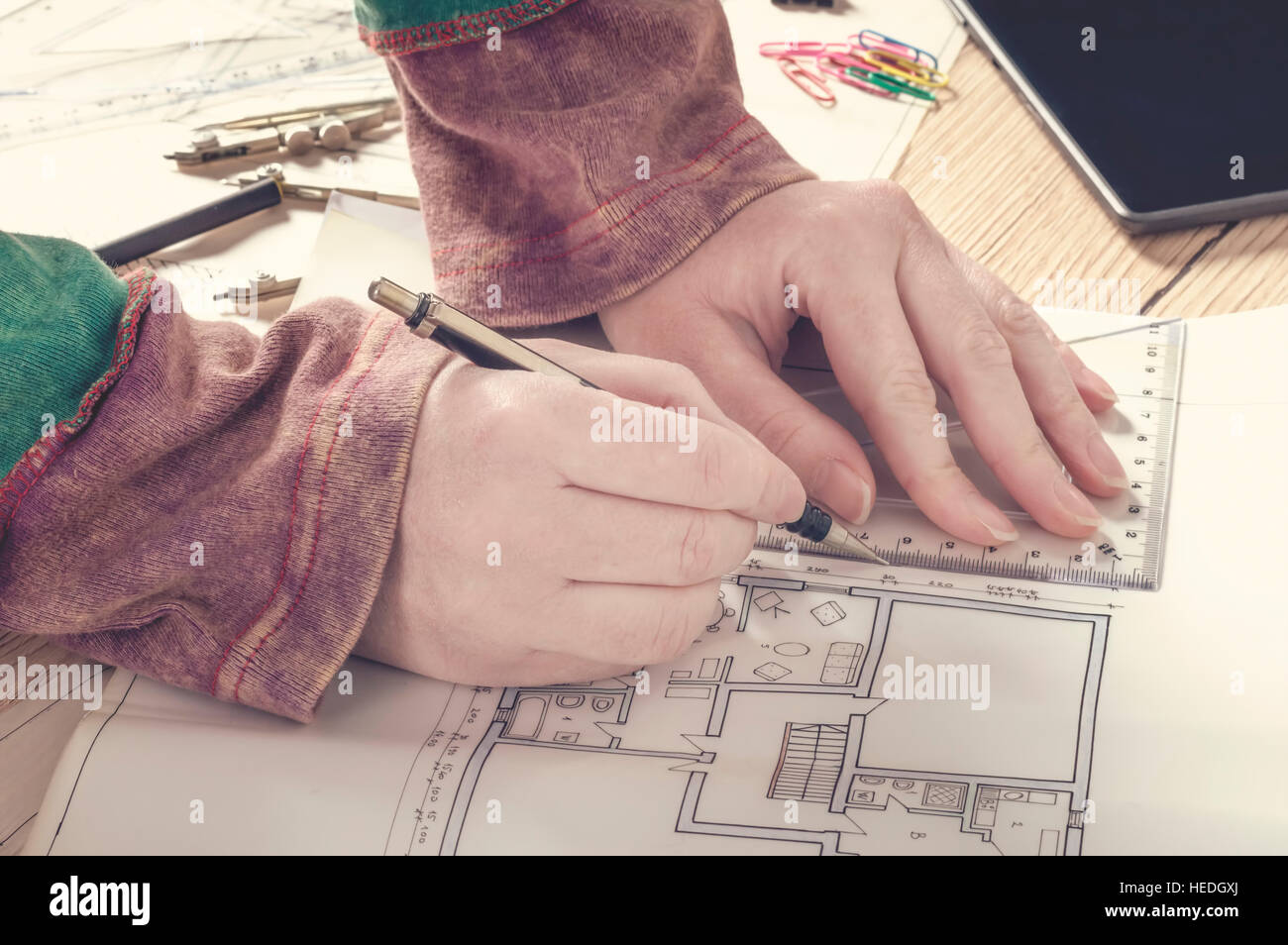 Architect drawing on architectural project. Hand writing on architectural plan. Construction concept. Stock Photo