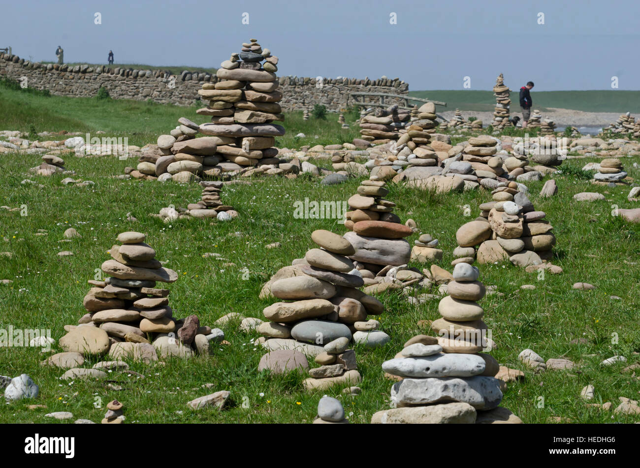 Pebble towers near the beach at Lindisfarne (Holy) Island in Northumberland, England. Stock Photo