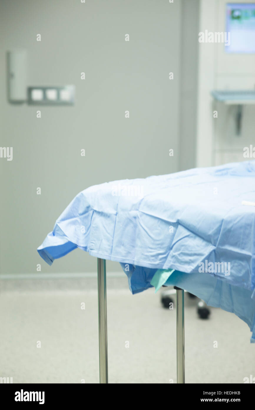 Hospital surgery bed in operating theater emergency room prepared for