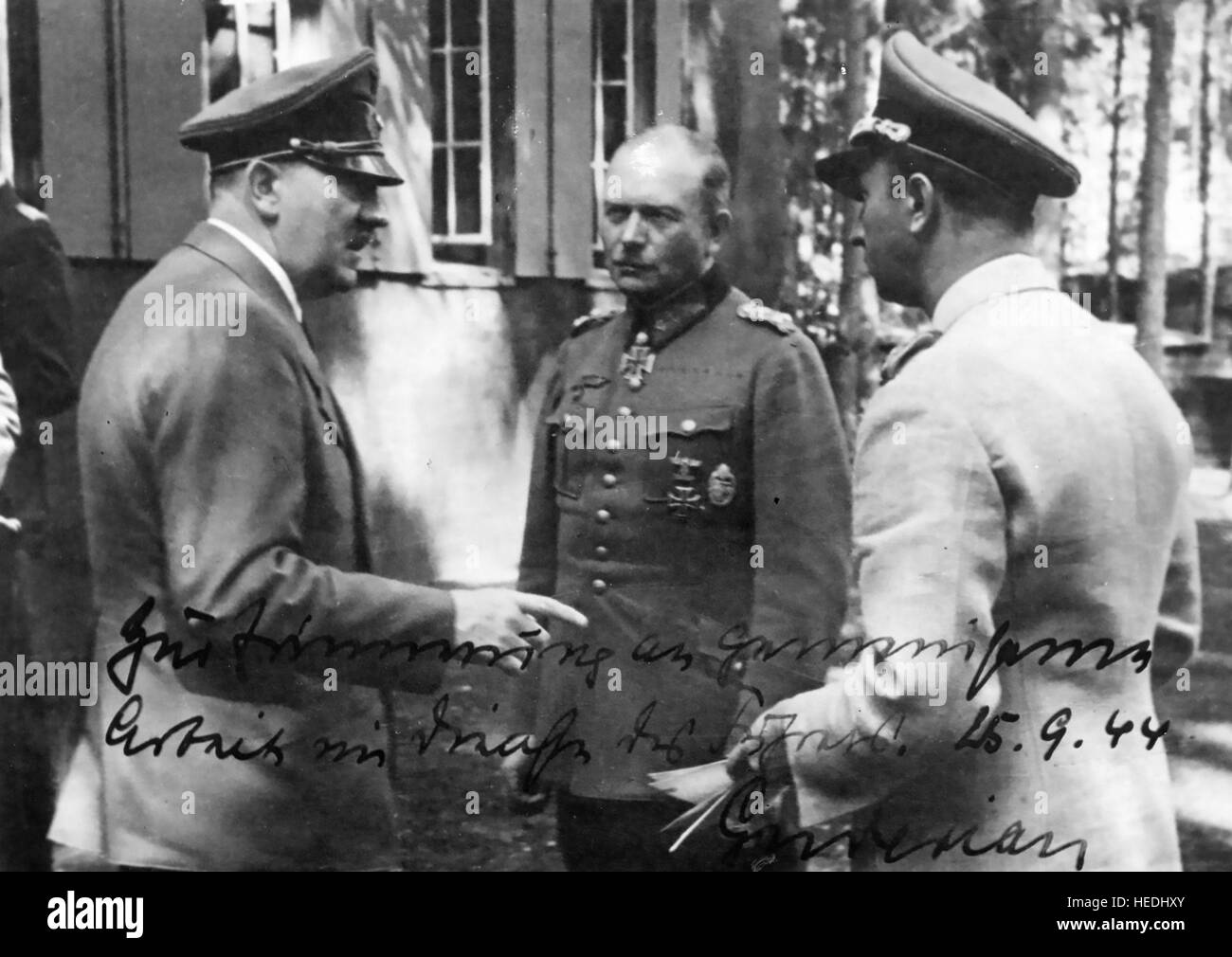 HEINZ GUDERIAN (1888-1954) German Panzer leader (centre) with Hitler at left and Hermann Fegelin. Autographed photo given by Guderian to Fegelein on 15 September 1944 with the words 'In memory of joint effort in the service of our Fuehrer' Stock Photo