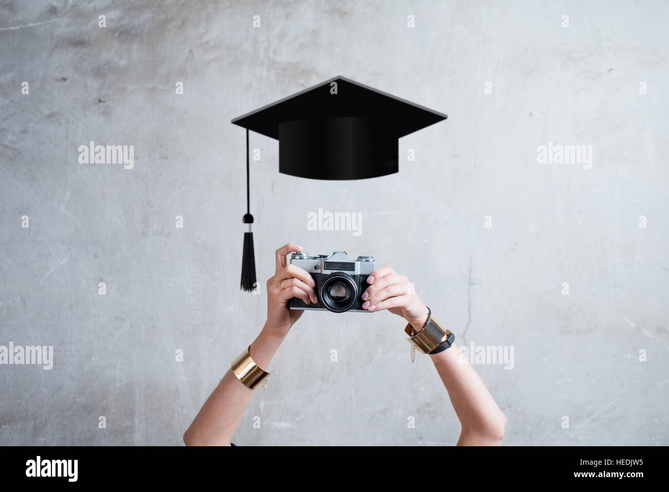 Photo camera on the gray wall background Stock Photo