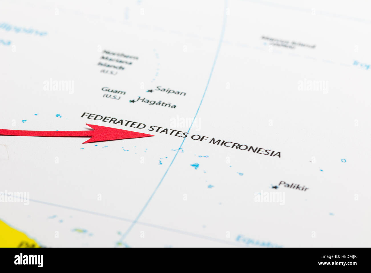 Red arrow pointing Federal States of Micronesia islands on the map of Pacific ocean Stock Photo