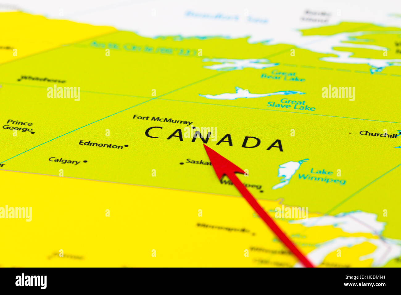 Red arrow pointing Canada on the map of north America continent Stock Photo