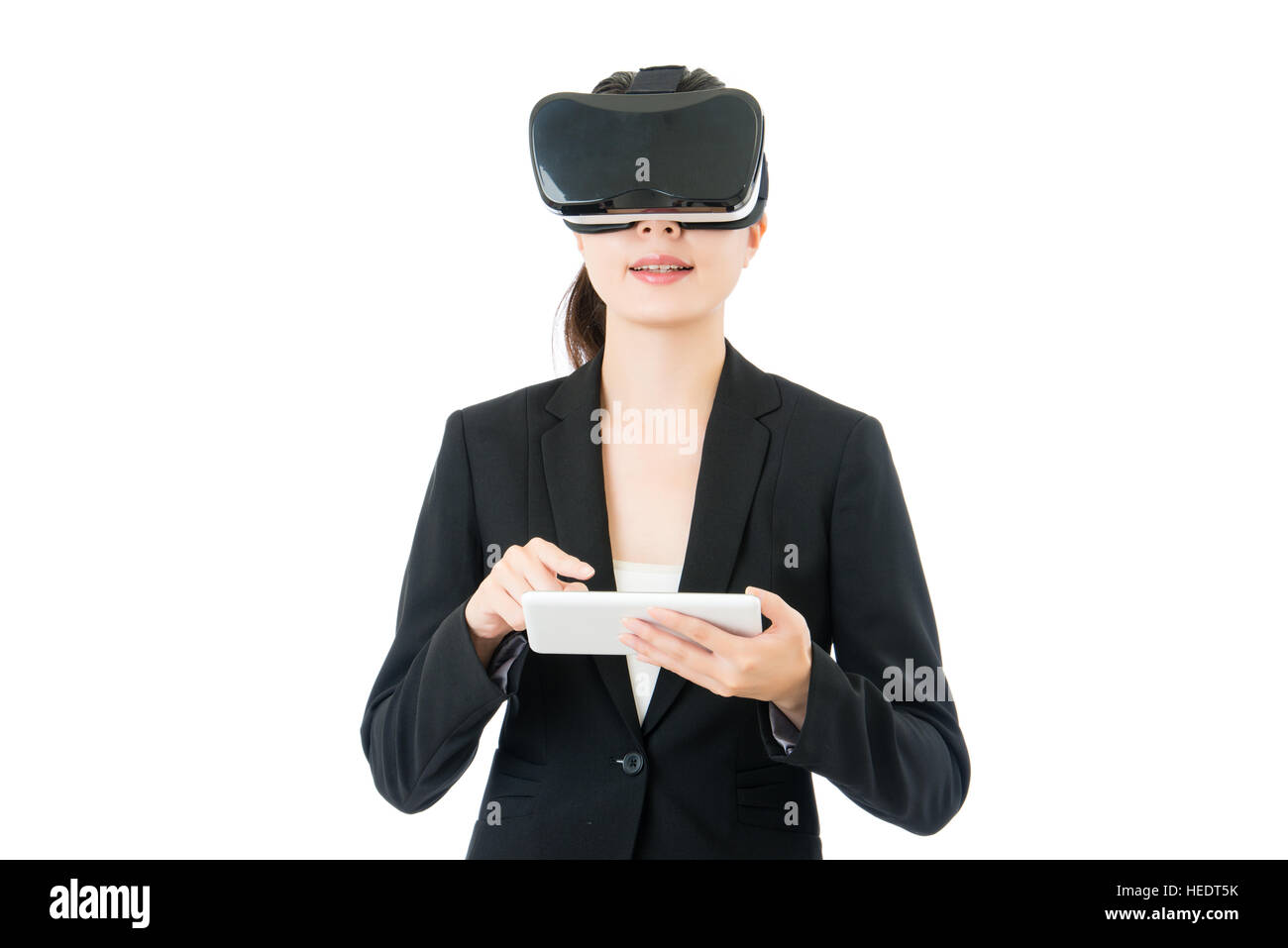 asian business woman use digital tablet to control virtual reality. VR ...