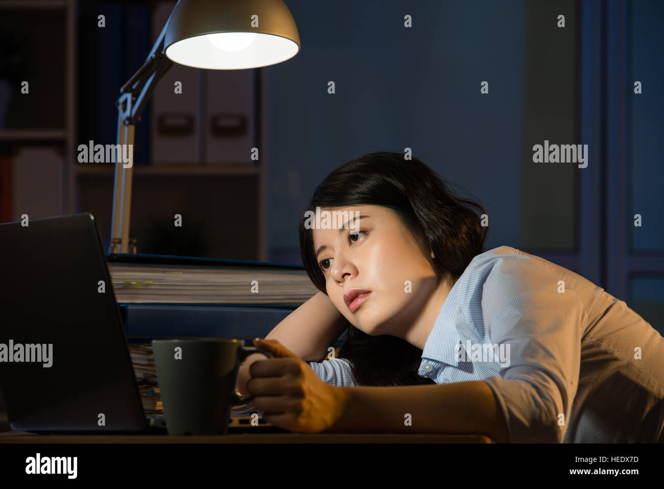 Asian Business Woman Sitting At Desk Sleepy Working Overtime Late