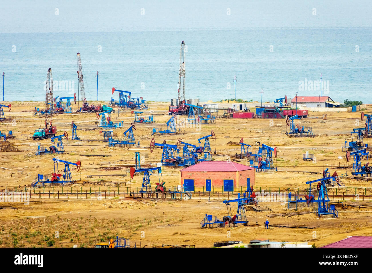 Oil pumps and rigs at the field by Caspian sea near Baku, Azerbaijan Stock Photo Alamy