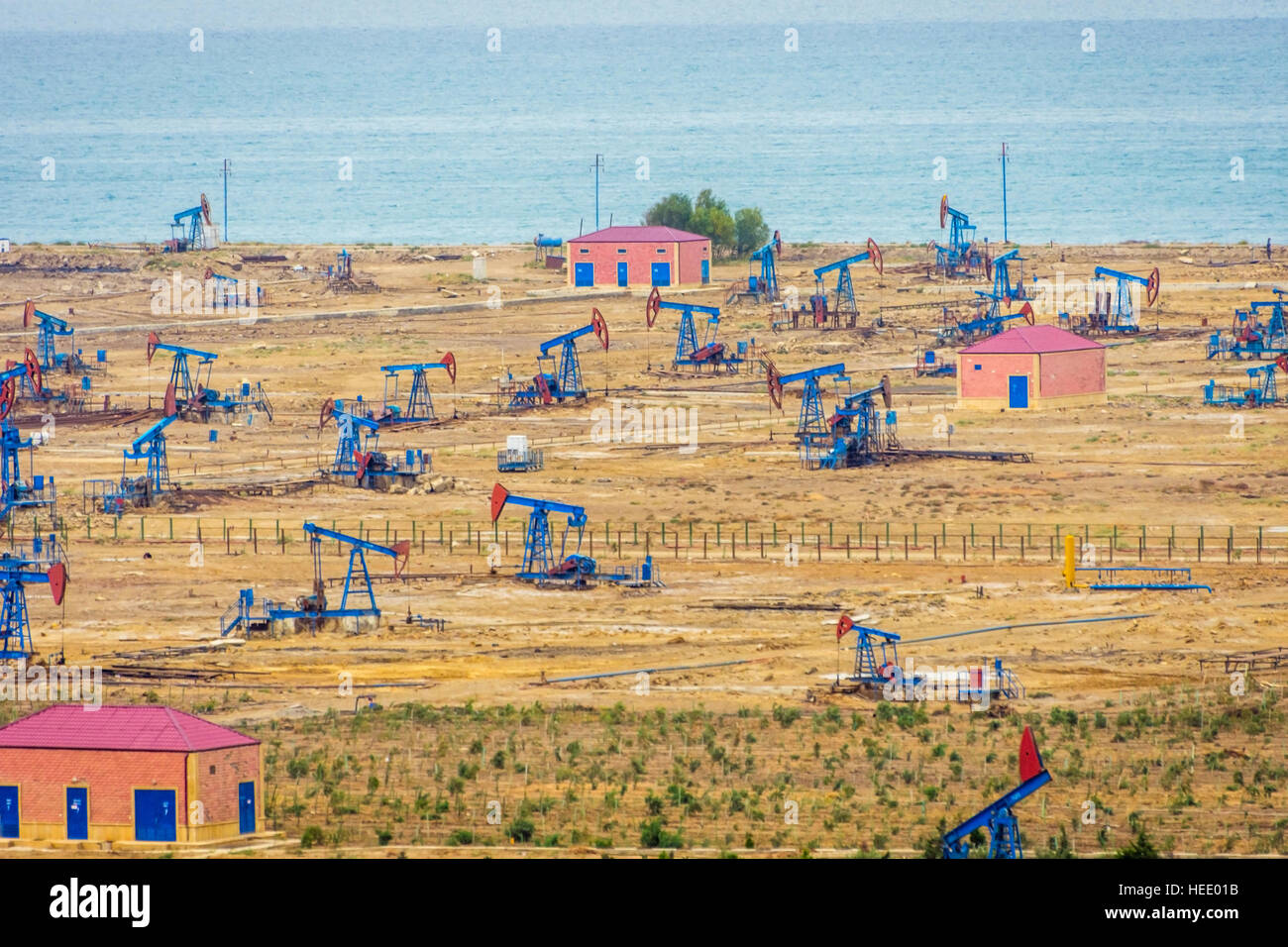 Oil pumps and rigs at the field by Caspian sea near Baku, Azerbaijan Stock Photo