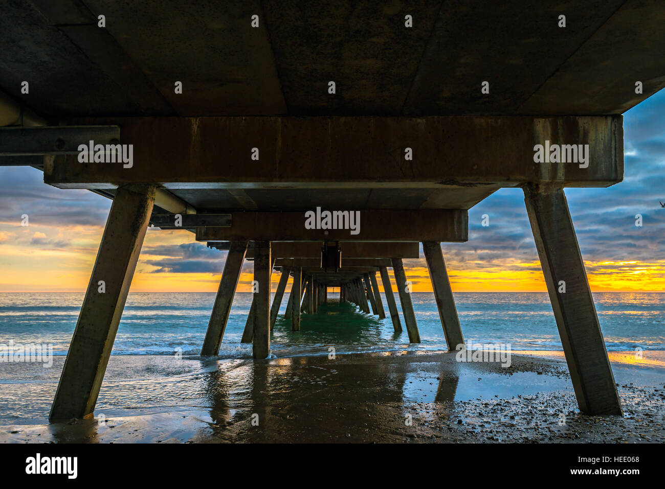 Glenelg Jetty at sunset, view from down under, South Australia Stock Photo