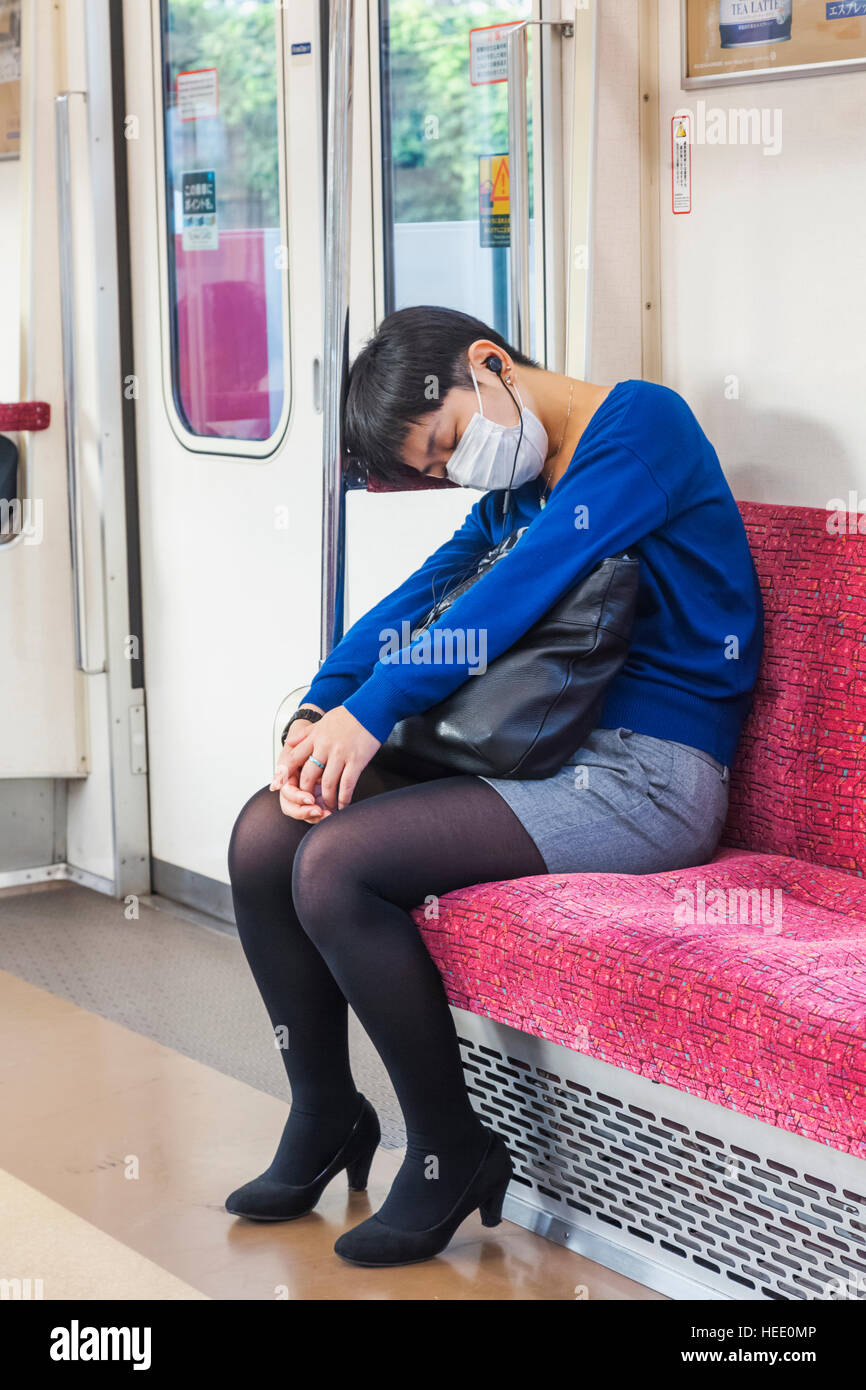 Japan, Honshu, Tokyo, Sleeping Female Train Passenger Stock Photo