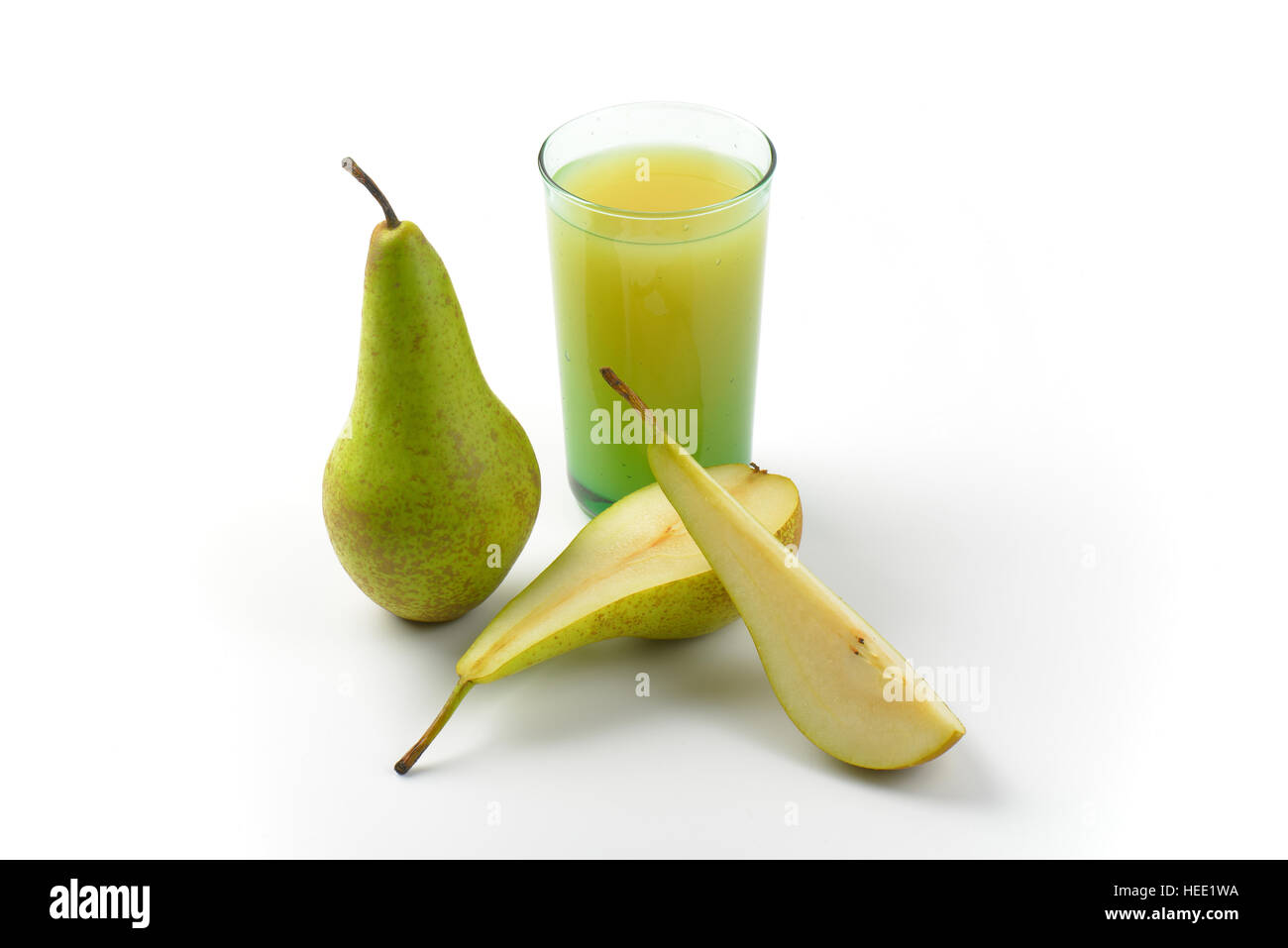 glass of pear juice and fresh pears next to it Stock Photo
