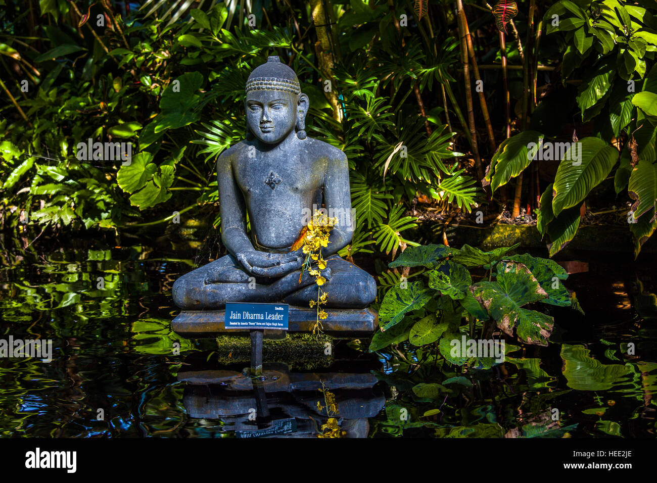 Statue in Koi pond in Marie Selby Botanical Gardens in Sarasota Florida Stock Photo