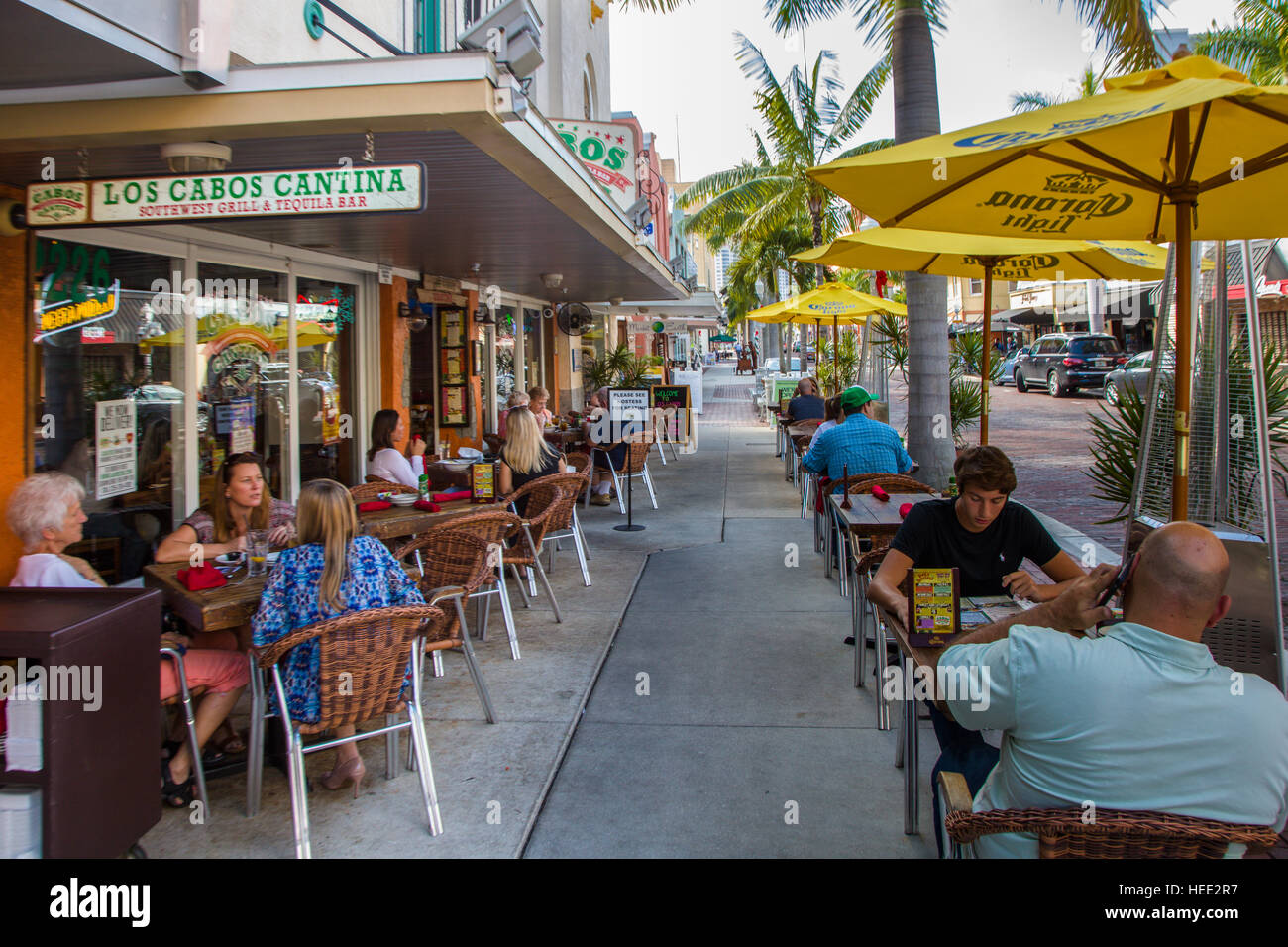 Outdoor dining on sidewalk at restaurant on First Street in Fort Myers Florida Stock Photo